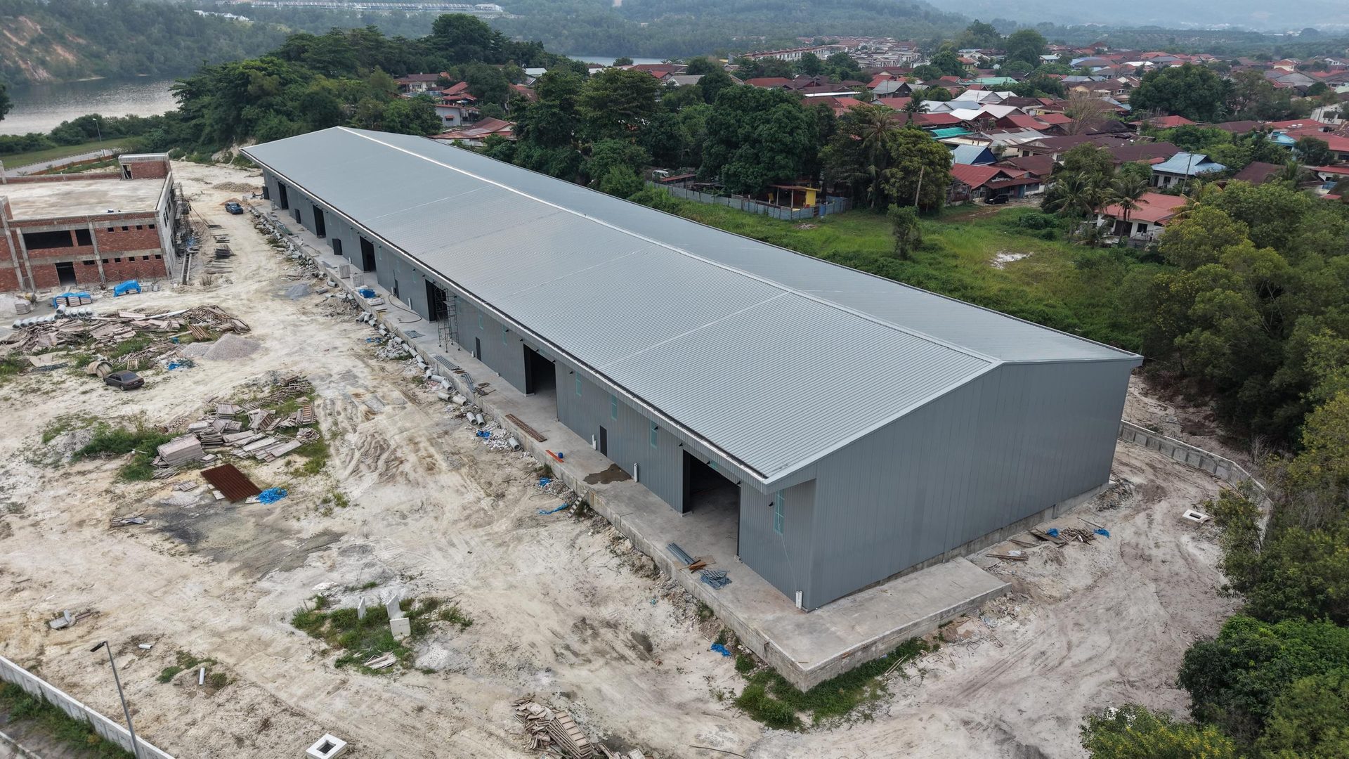 Full-length aerial of the warehouse with roof sheeting complete