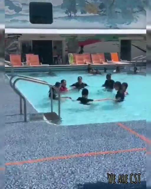 Team in the cruise deck pool, splashing around